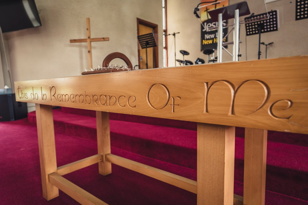 Services a-wooden-table-with-a-cross-on-top-of-it-mj3tnridwp0
